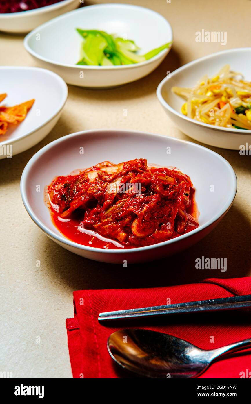 Korean dinner banchan side dishes including kimchi and soybeans Stock