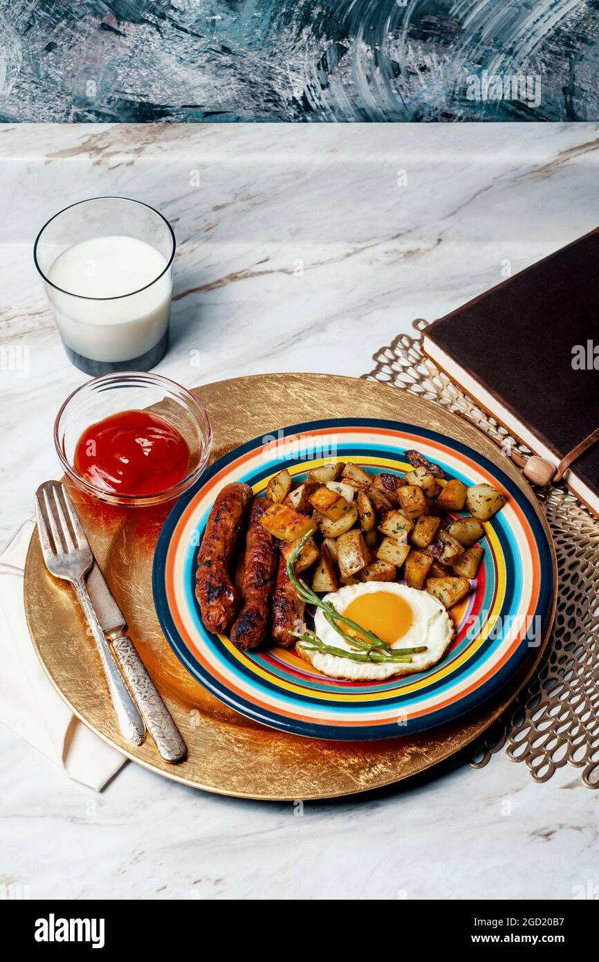 Complete American breakfast fried sunny side up eggs sausage potatoes o