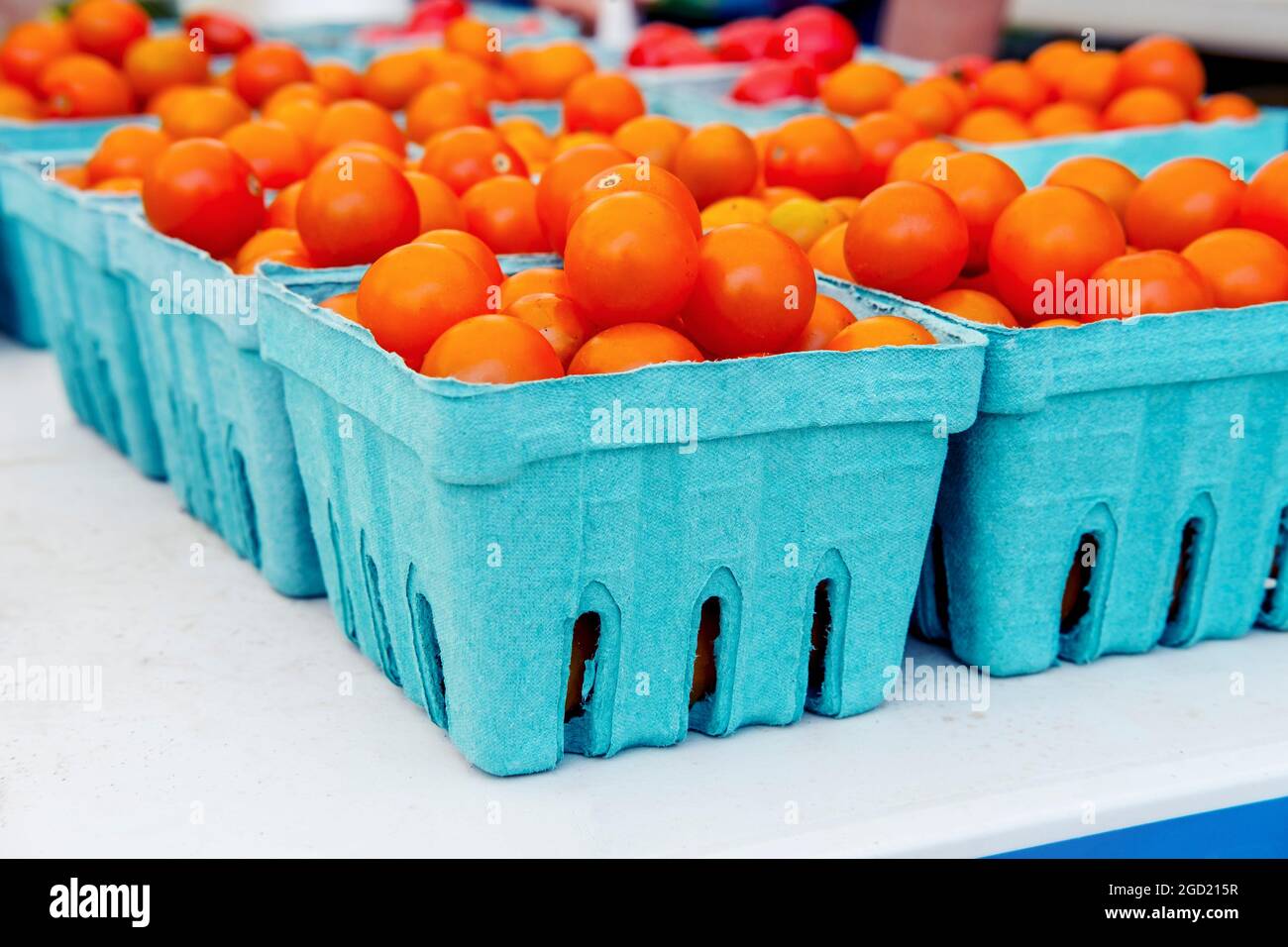 Baskets of fresh organic red cherry tomatoes at local farmers market ...