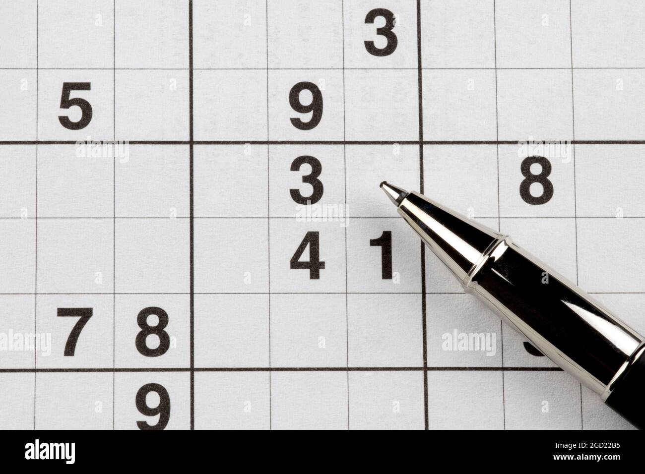 Sudoku number puzzle and pen closeup view Stock Photo