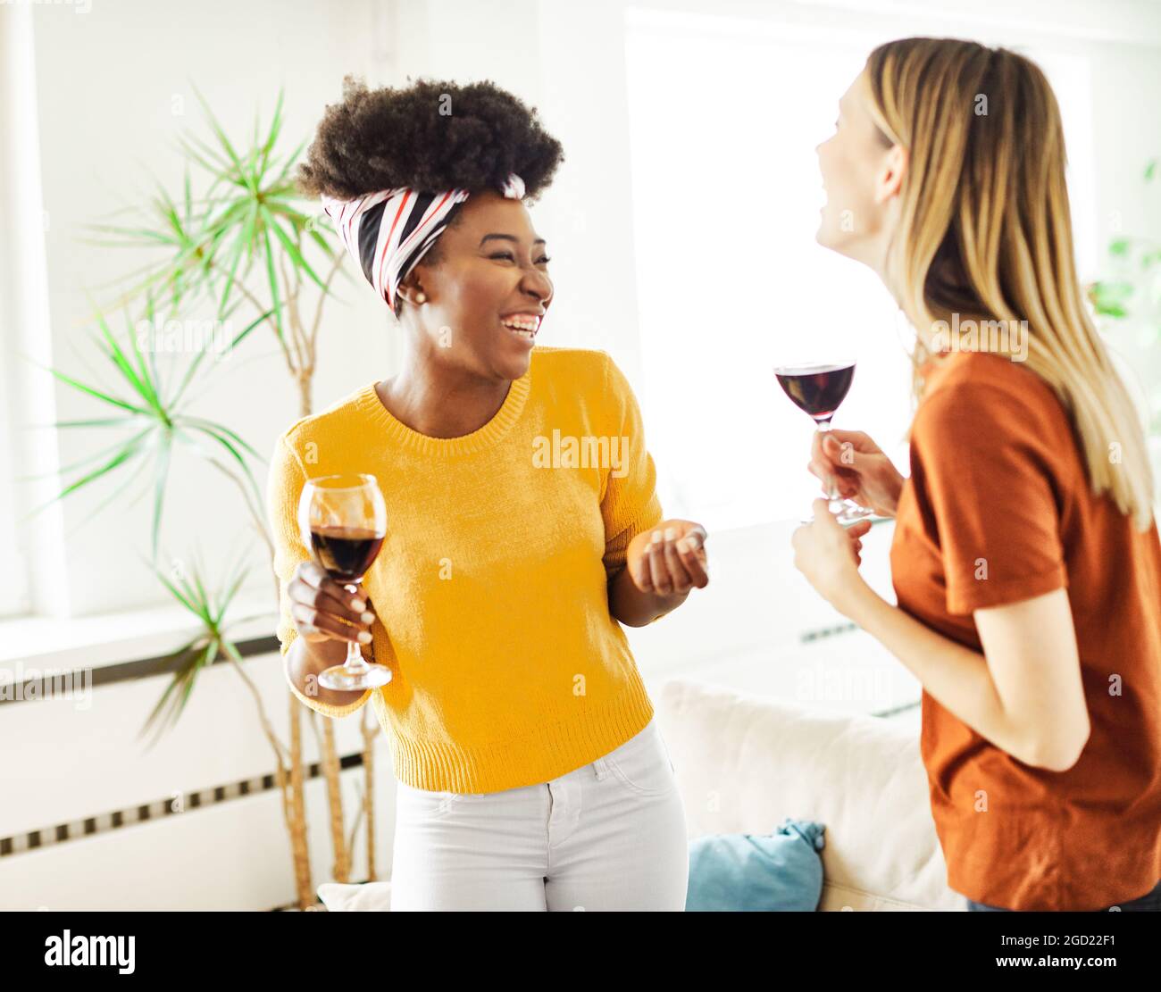 girl party dancing drinking wine happy fun friend care free carefree glass drink beautiful youth woman Stock Photo
