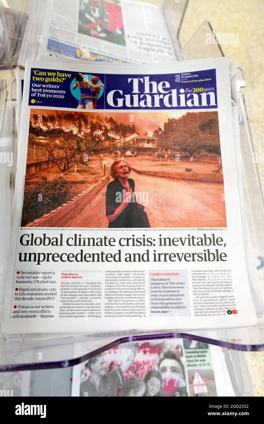'Global climate crisis: inevitable, unprecedented and irreversible' Guardian newspaper headline front page on news rack 10 August 2021 in London UK Stock Photo