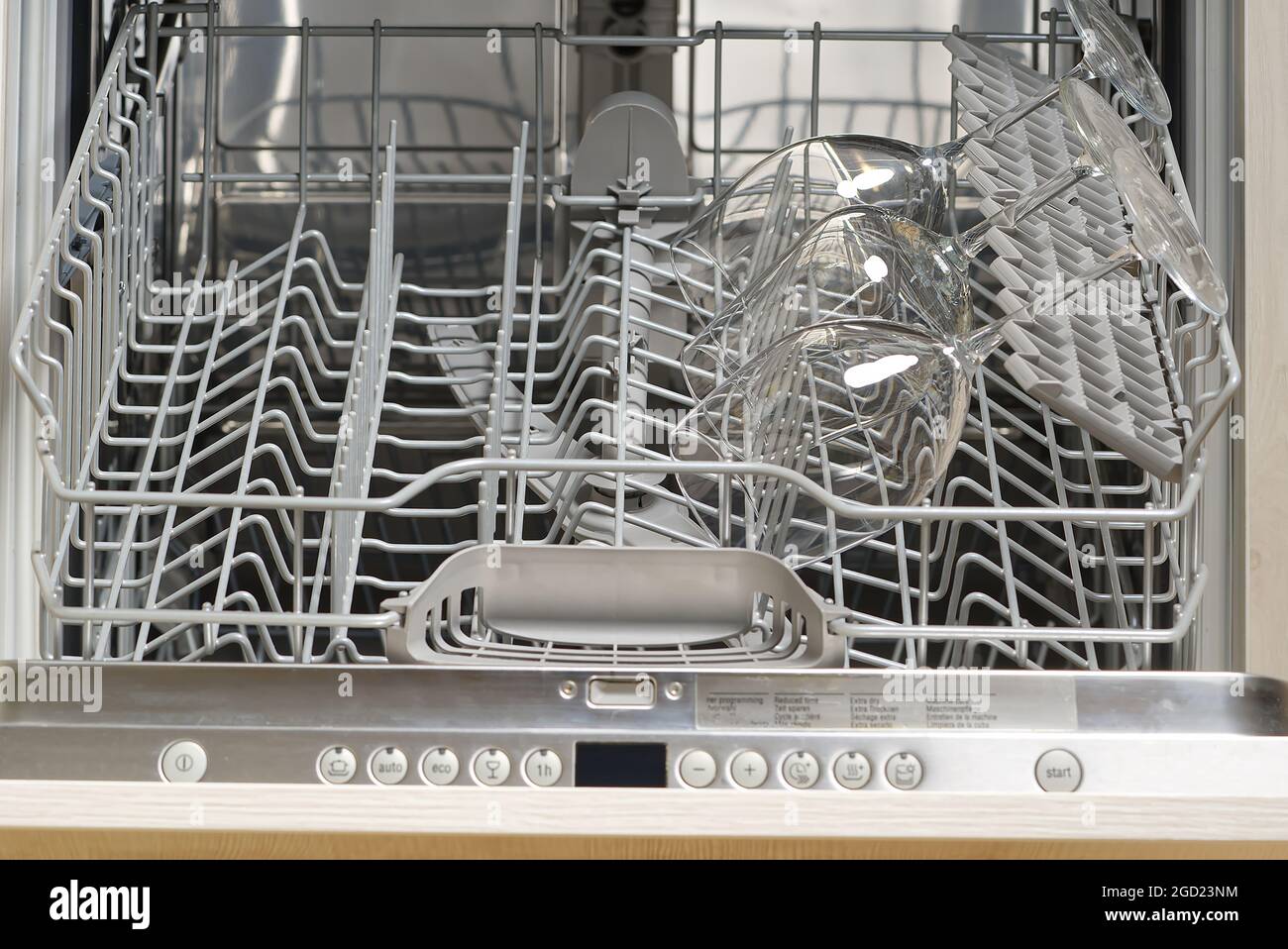 clear glass wine glasses in the dishwasher. Clean transparent dishes after washing in dishwasher