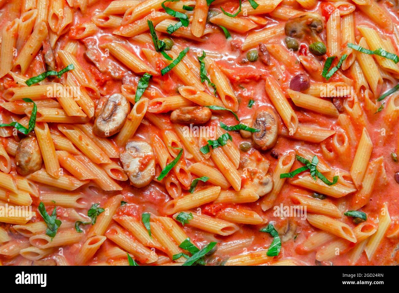 Cooking penne alla zingara with Italian pink vodka sauce Stock Photo