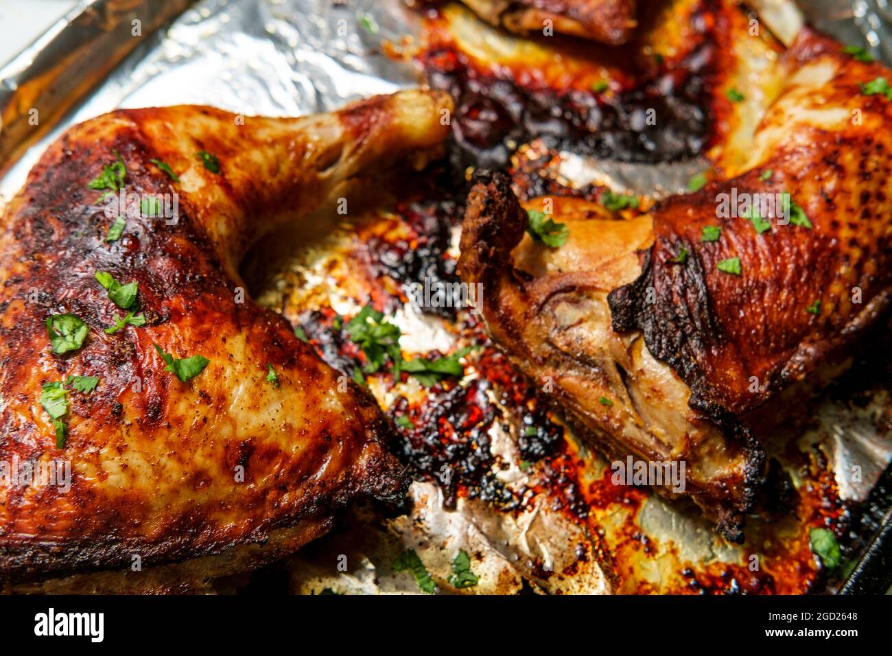 Cooking Peruvian roast chicken leg dinner Stock Photo Alamy