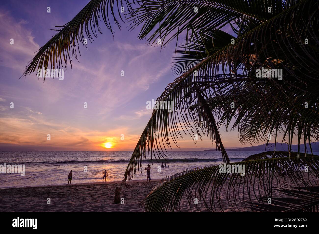 Peaceful sunset on the beach in Nuevo Nayarit with golden sky