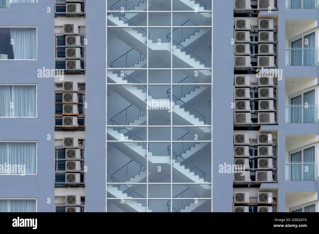 Stairway fire escape is integrated into the interior of high rise residential building Stock Photo