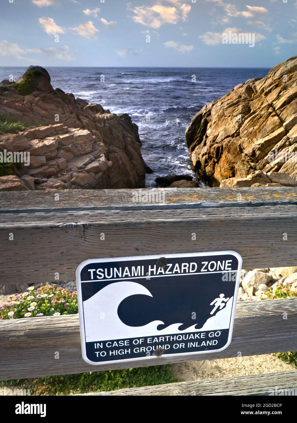 CALIFORNIA Tsunami sign earthquake hazard zone warning sign on coastal 17 mile drive Pacific Grove Pebble Beach Monterey California USA Stock Photo
