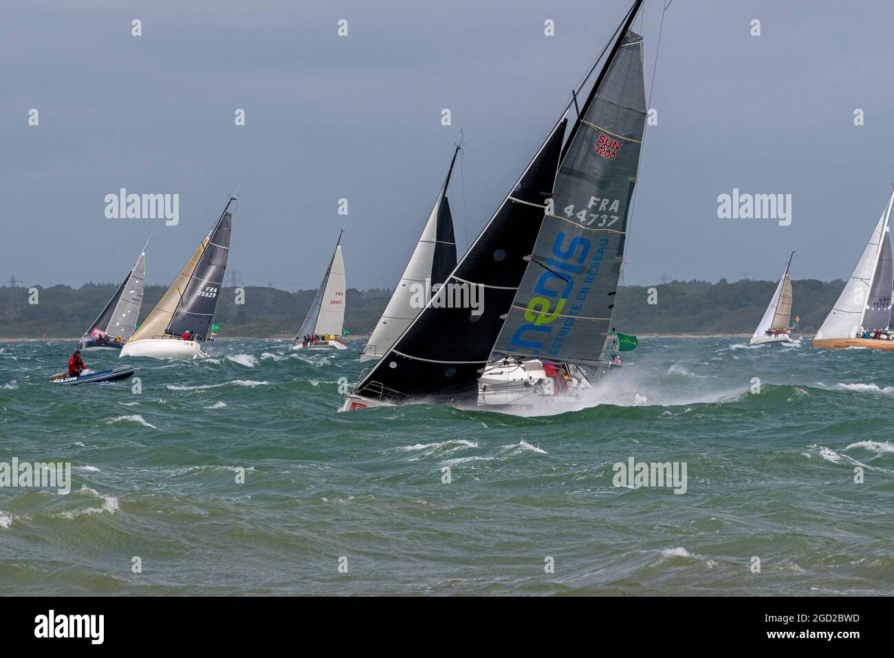 Start of the Rolex Fastnet Race on 8 August 2021. The competitors faced gruelling conditions with high westerly winds.  Cowes, Isle of Wight, England Stock Photo