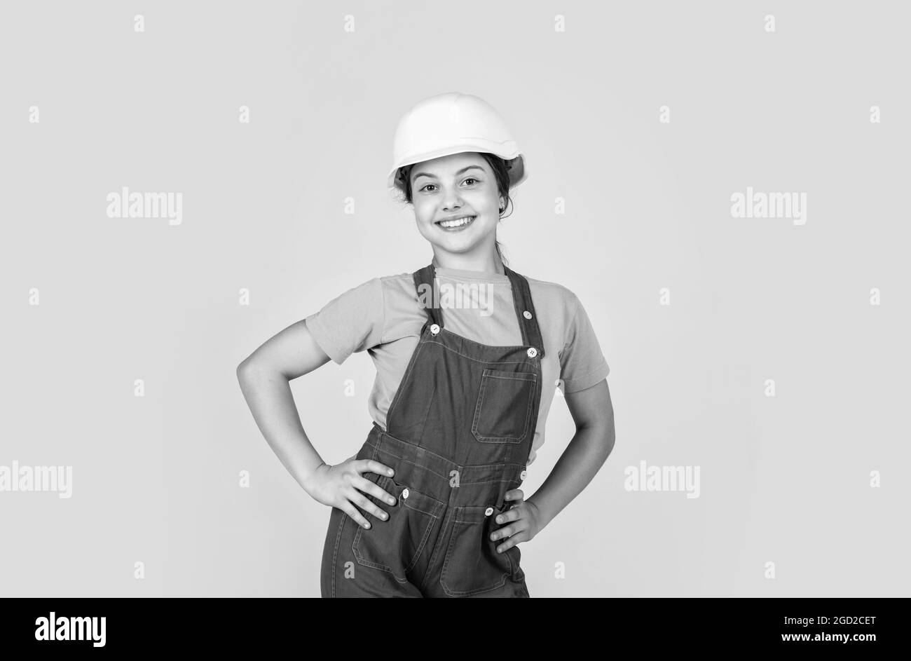 Assistant. Portrait of little girl with hard hat. Little girl in hard