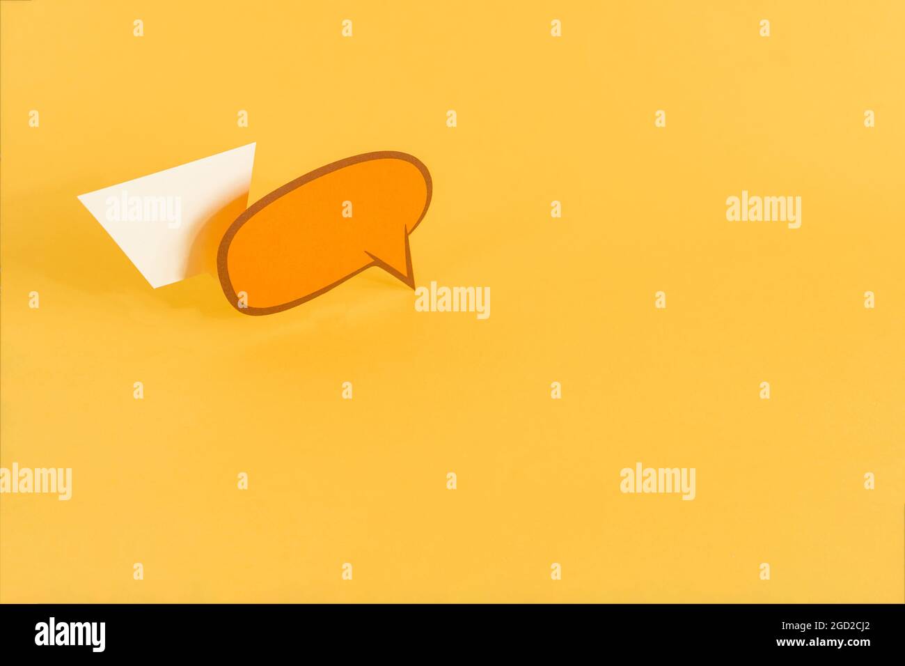 Paper speech bubbles on yellow background with a copy s Stock Photo - Alamy