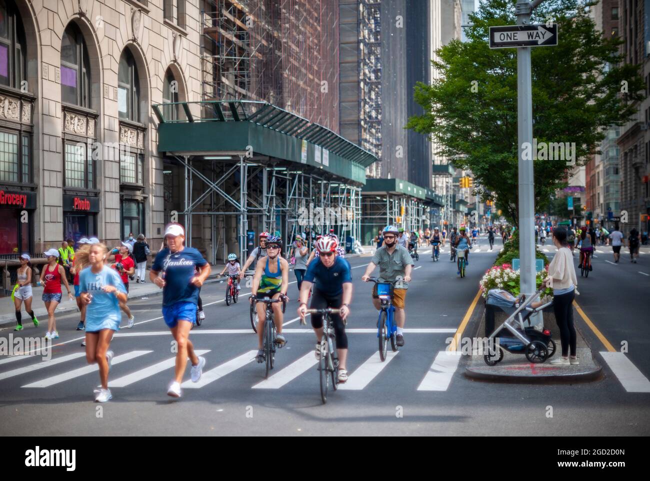 Bicycles, runners and pedestrians on Park Avenue on Saturday, August 7, 2021 for the New York Summer Streets event. After a pandemic hiatus Summer Streets is back with 6.9 miles of Manhattan streets cleared of traffic from 7 A.M. to 1 P.M. The event will repeat on August 14. (© Richard B. Levine) Stock Photo