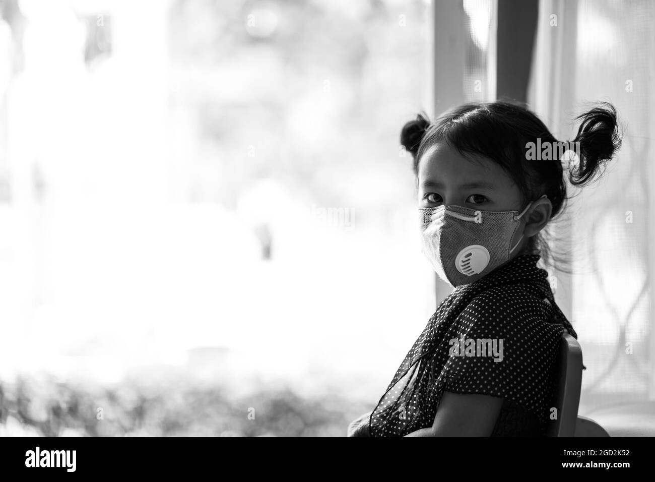 Little girl with mask Black and White Stock Photos & Images - Alamy