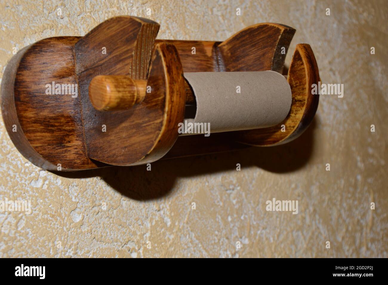 Empty toilet paper roll on a wooden hanger Stock Photo - Alamy
