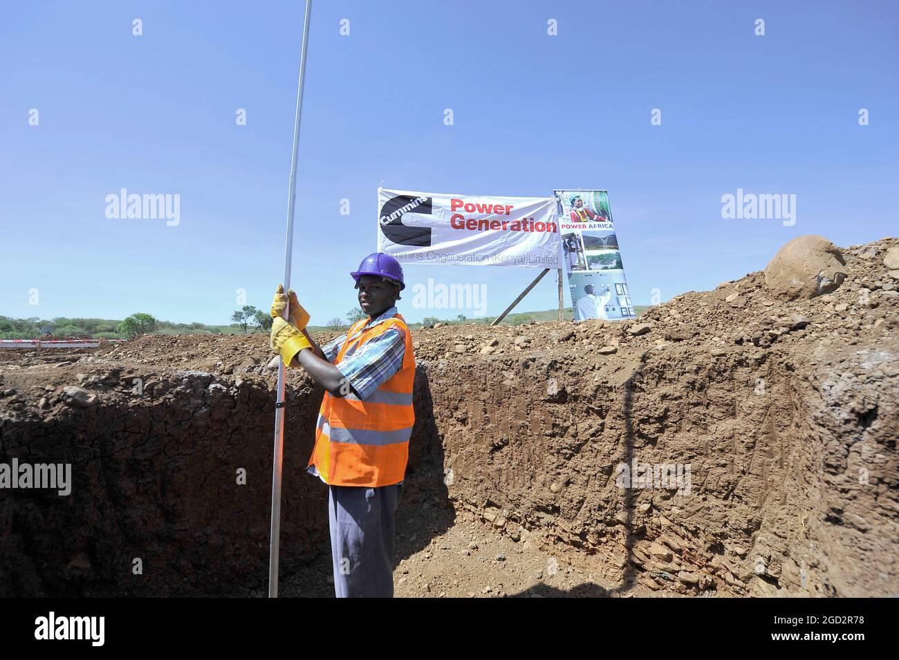 A construction worker in last minute preparations at the project site where the new biomass energy power plant will be built in Marigat, Baringo County Kenya ca. 28 January 2014 Stock Photo