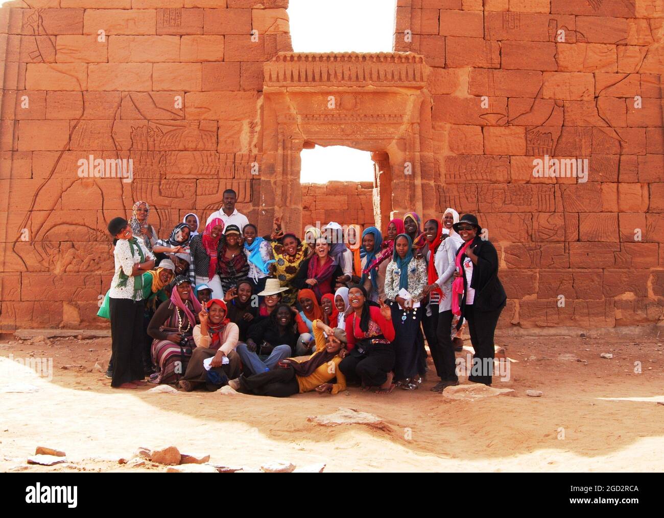 The students visiting the temple at Naqa, a ruined ancient city of the Kush Kingdom, north of Khartoum. The exchange included field trips to great Sudanese historical sites to teach the students about their common identity and culture ca. 18 April 2012 Stock Photo
