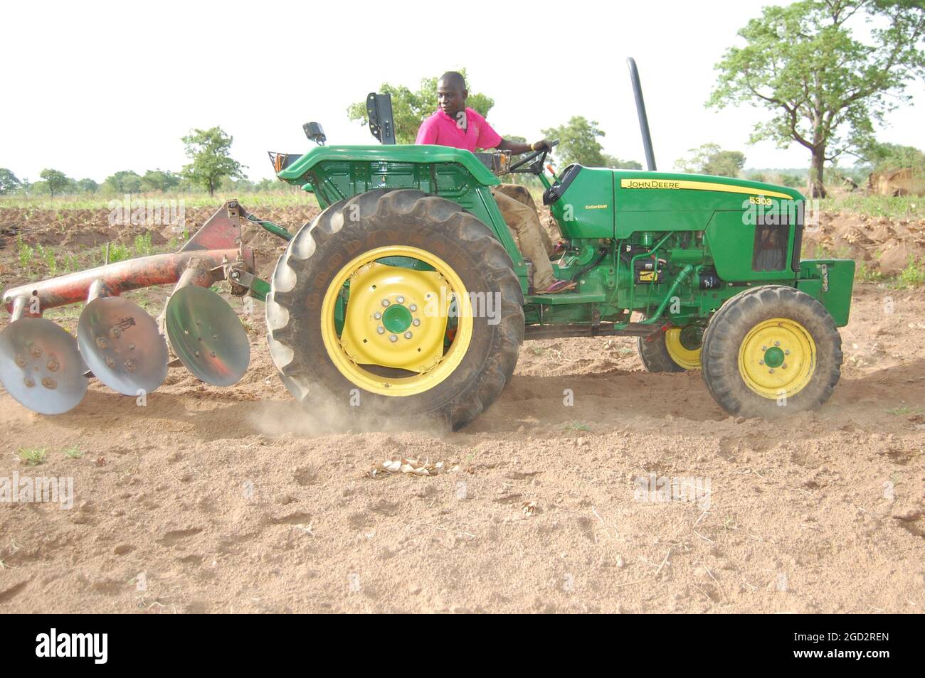 AA Ataqwaah riding his new John Deere tractor on his farm (probably in