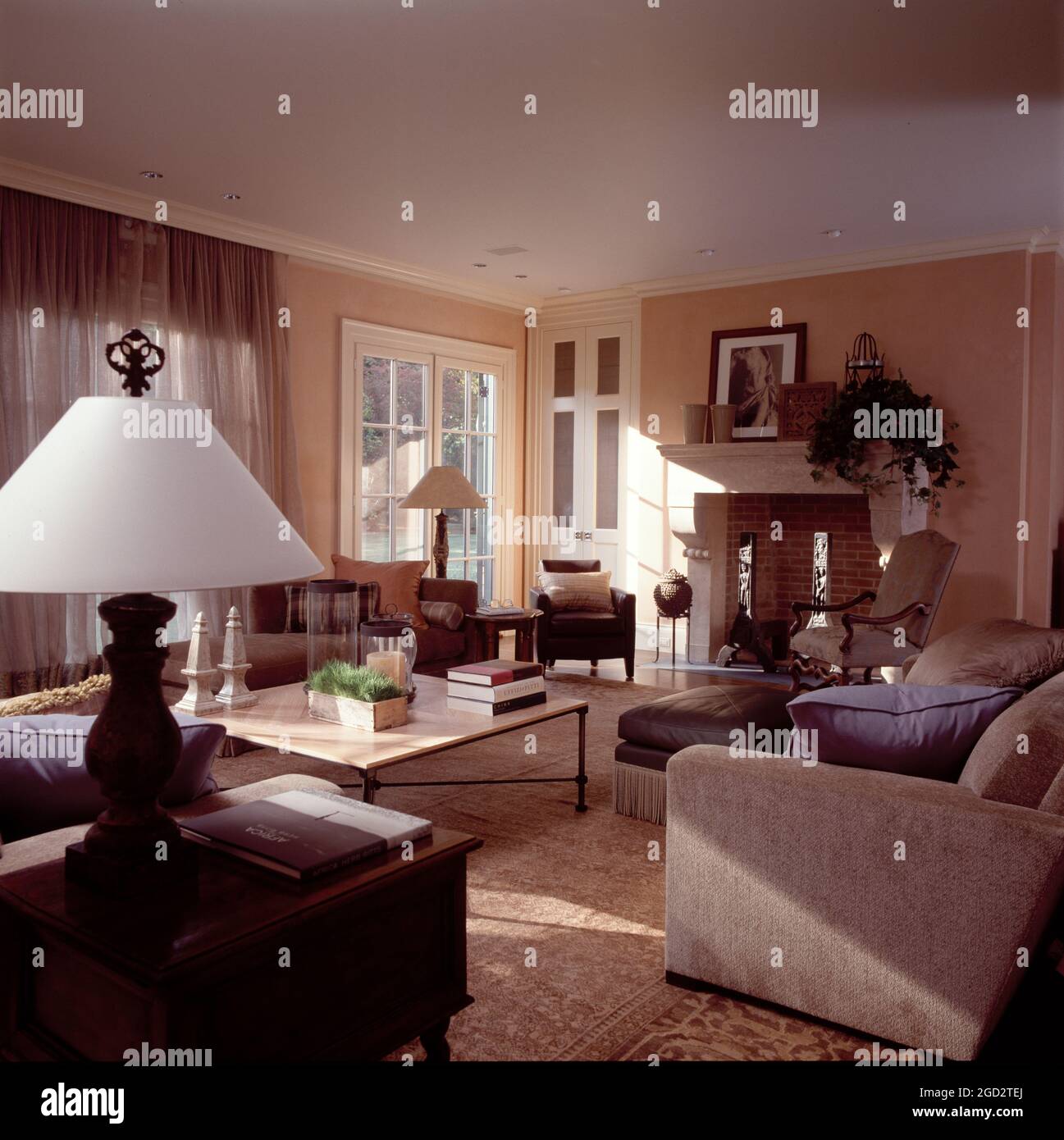 Designer livingroom furnished with beige and grey-blue sofas. Stock Photo