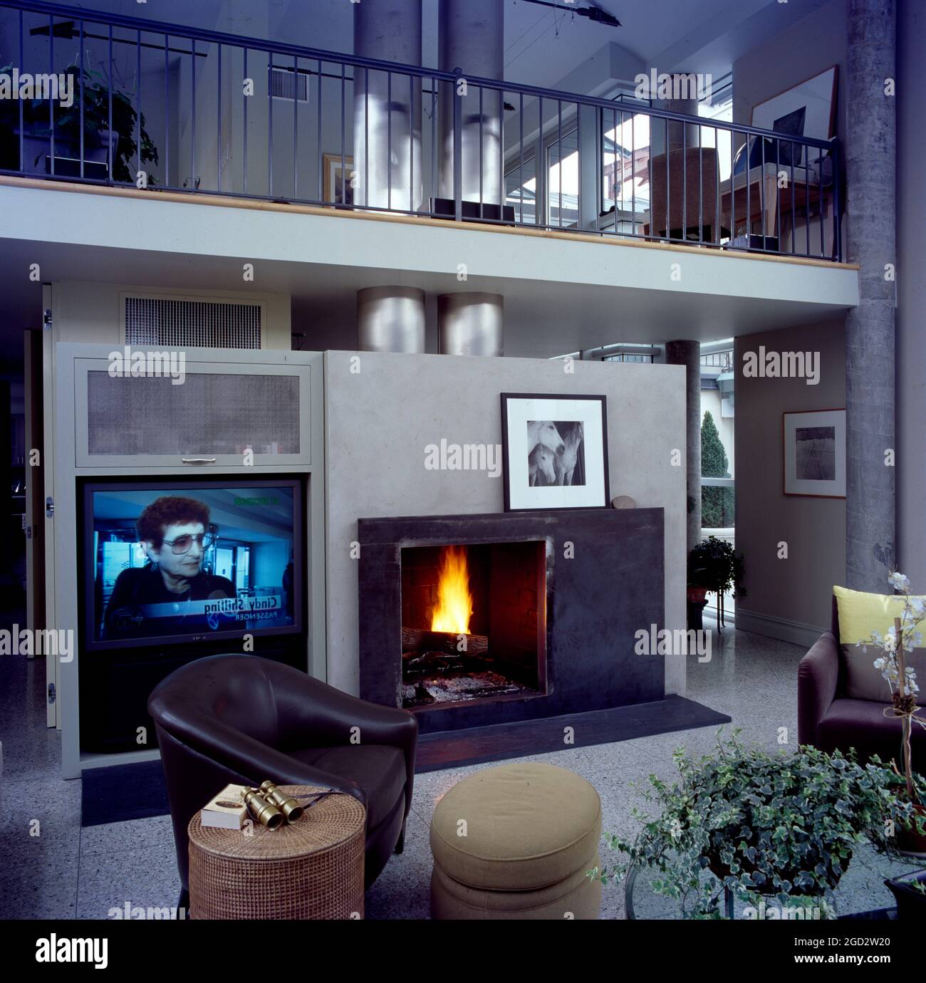 Designer livingroom in NYC with gallery and open fire Stock Photo