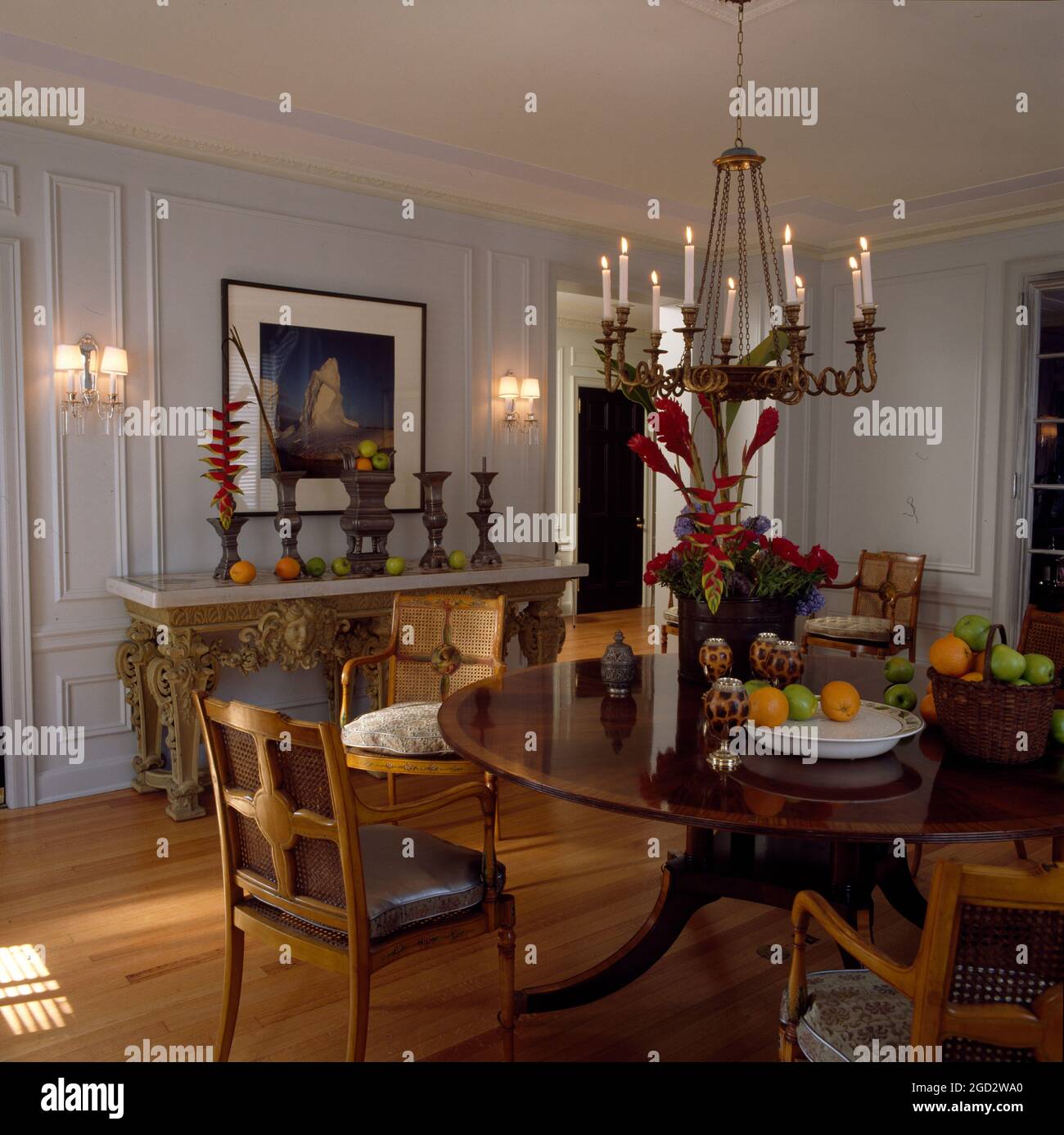 Designer diningroom in NYC with chandelier and wall lights. Stock Photo
