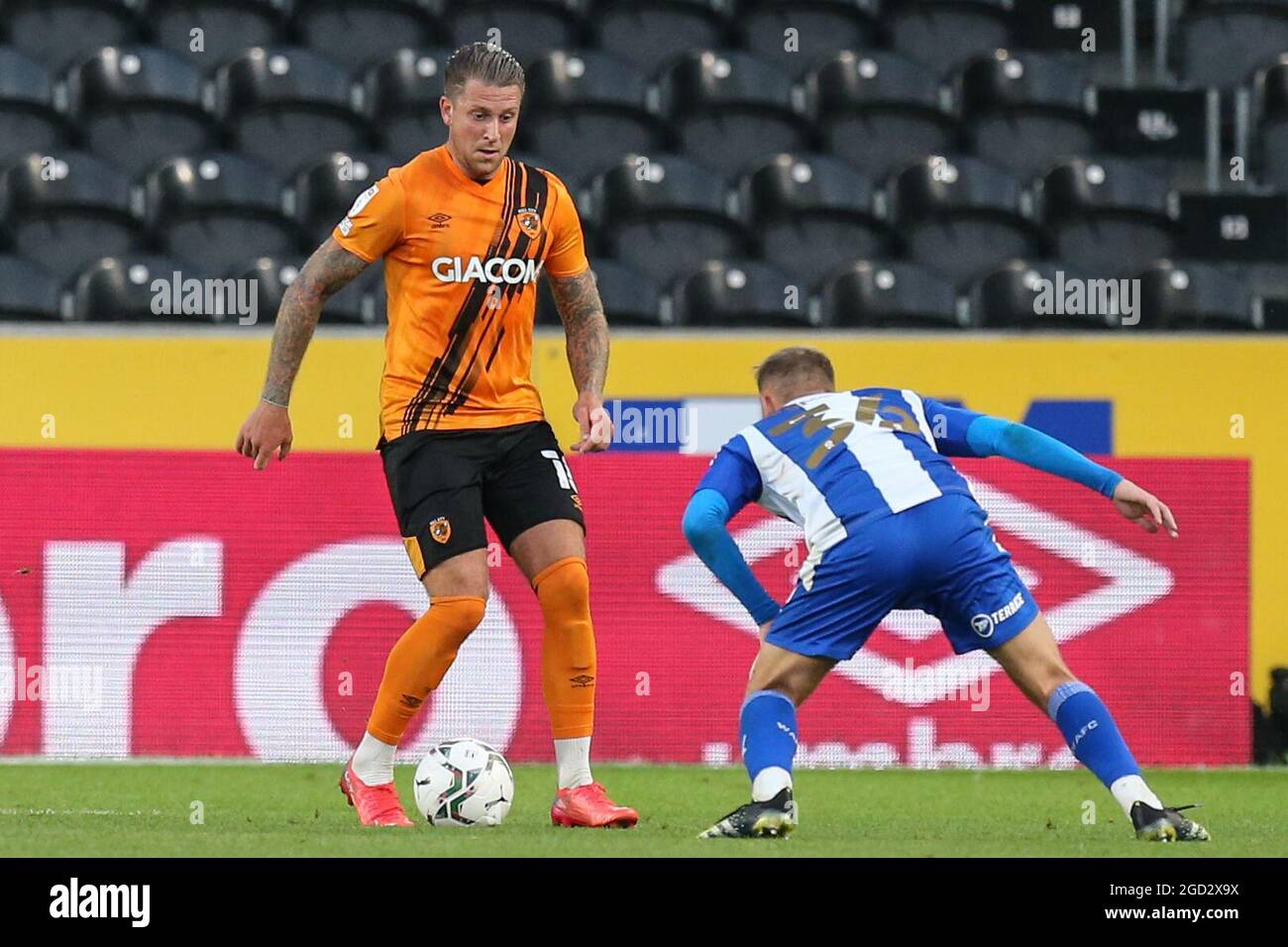 George Moncur #18 of Hull City looks to go past Scott Smith #36 of Wigan Athletic in, on 8/10/2021. (Photo by David Greaves/News Images/Sipa USA) Credit: Sipa USA/Alamy Live News Stock Photo
