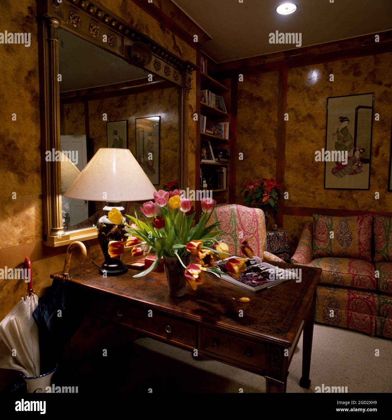 Desk with lamp in designer livingroom in NYC Stock Photo