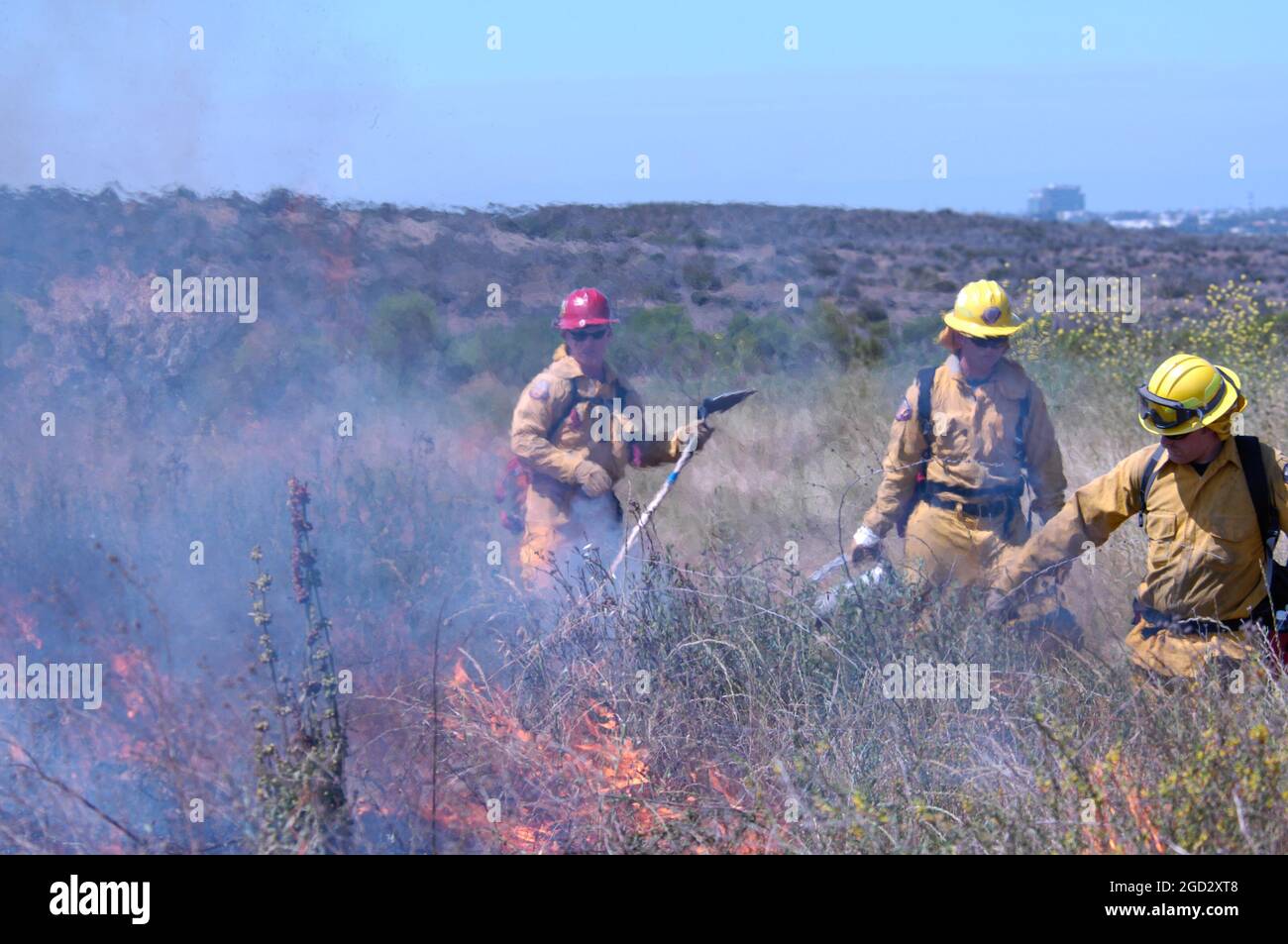 Miramar Firefighters igniting brush Stock Photo