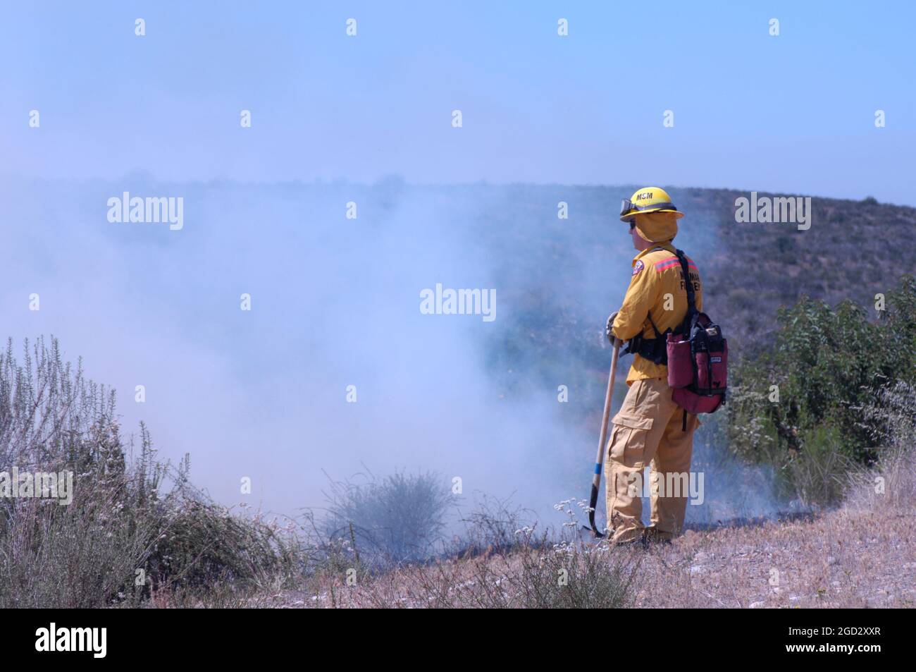 Miramar firefighter keeping watch on  controlled burn Stock Photo