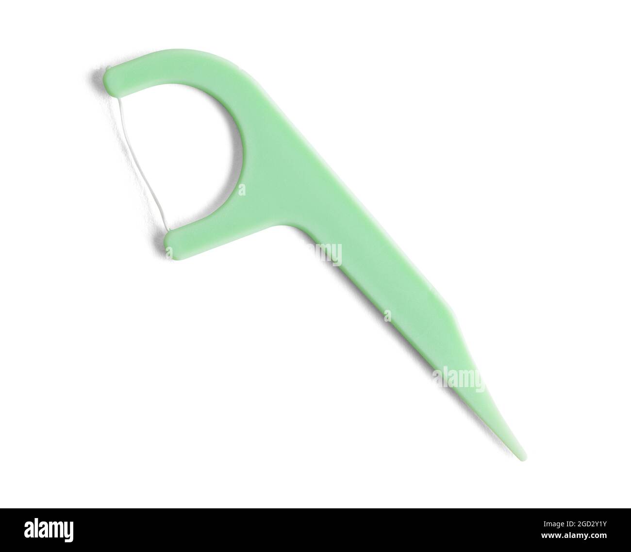 Green Plastic Dental Floss Pick Cut Out On White. Stock Photo