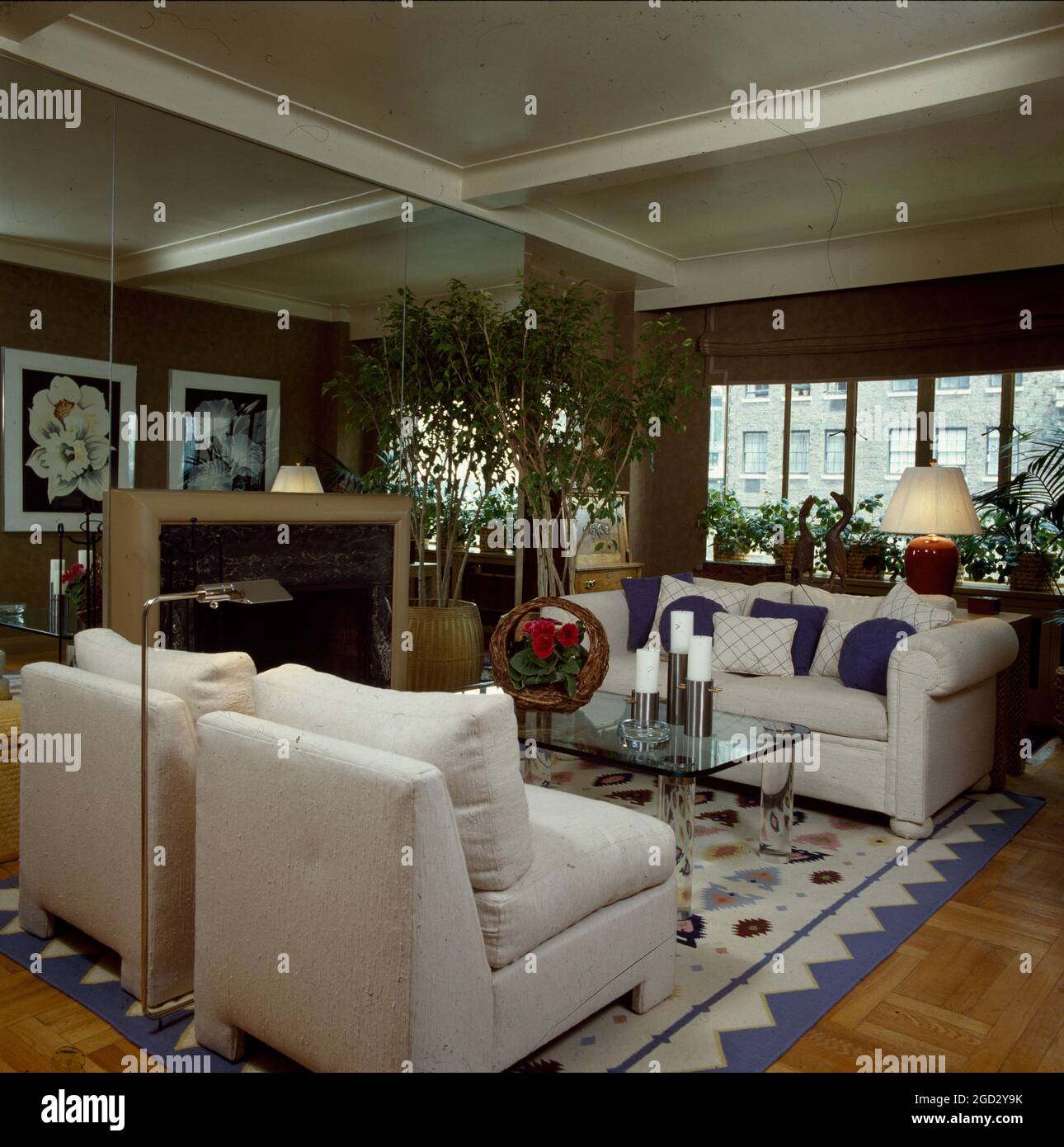 Designer livingroom with mirrored wall Stock Photo