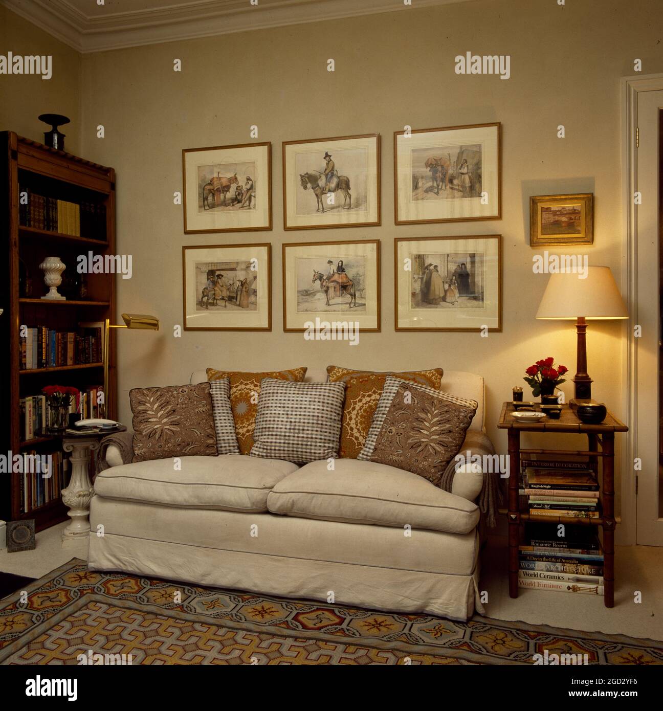 Designer livingroom in NYC with collection of old  prints. Stock Photo