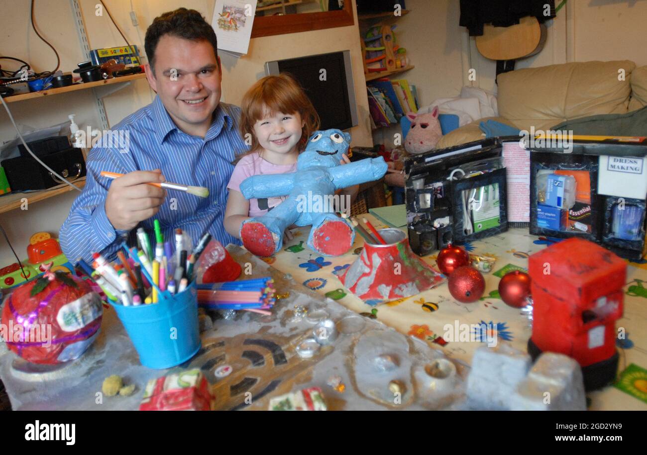 Matthew Taylor from Brighton  sets about making this years Christmas presents and decorations with daughter 3 year old Elizabeth with last years present Iggle Piggle made from toilet rolls. Pic Mike Walker, 2008 Stock Photo