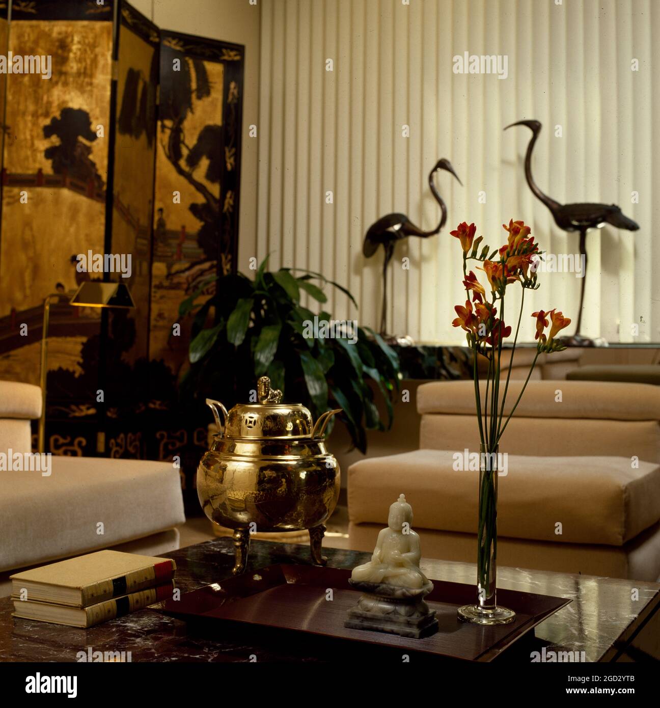 Designer livingroom in NYC with oriental screens and objects. Stock Photo