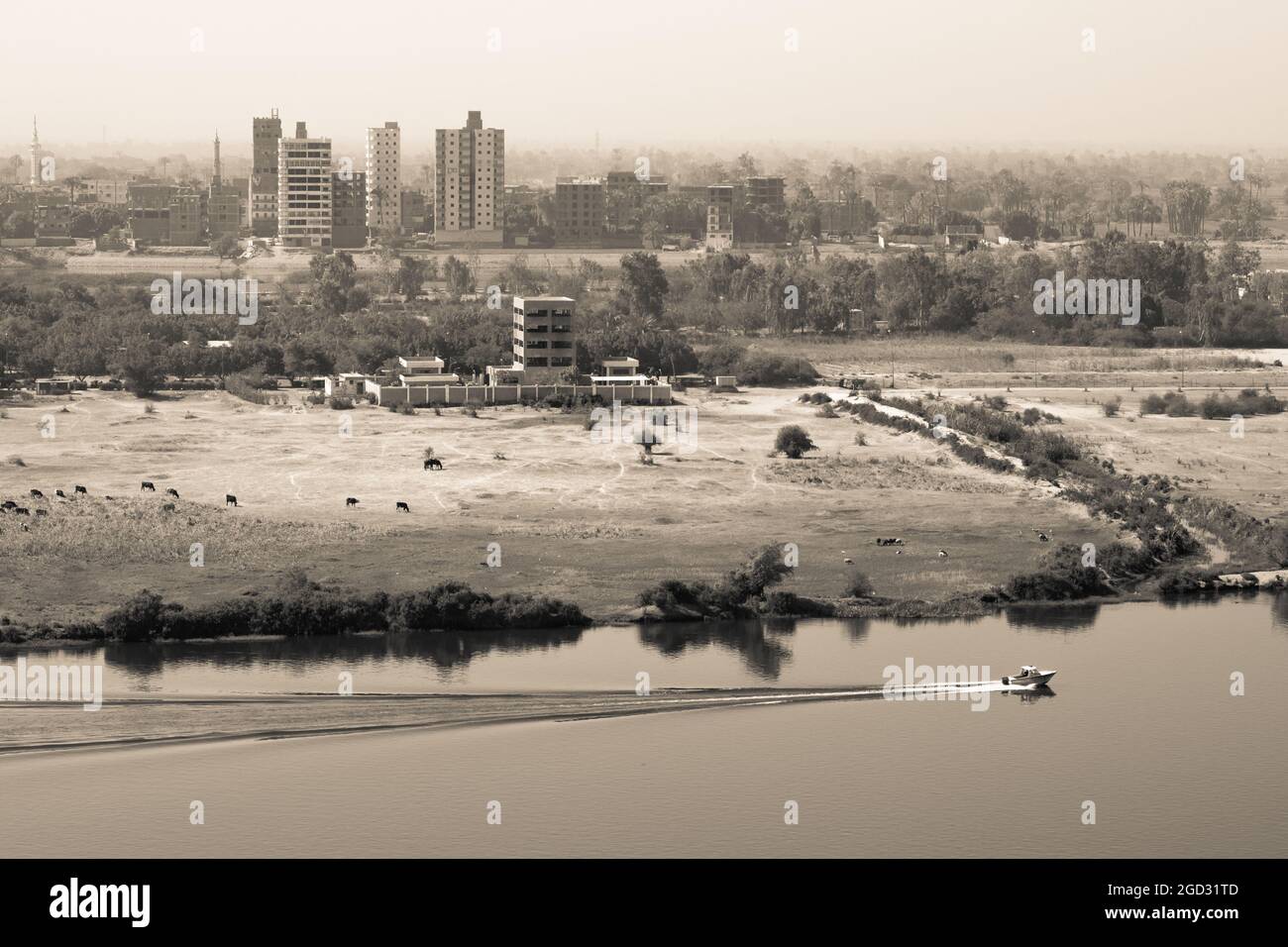 Vintage photo of Sohag city showing the Nile river and some buildings on a grayscale Stock Photo