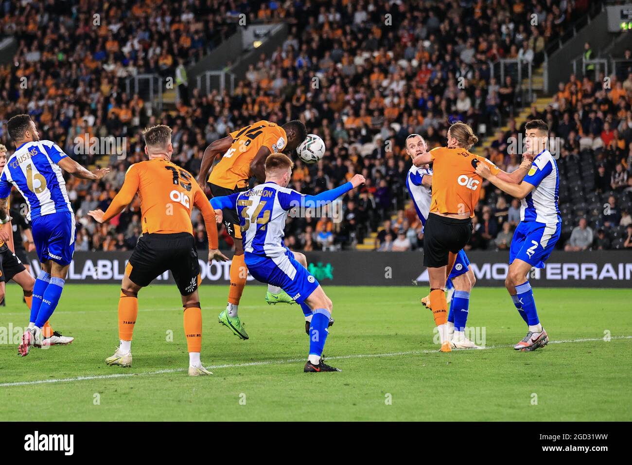 Hull, UK. 10th Aug, 2021. Di'Shon Bernard #24 of Hull City heads the ...