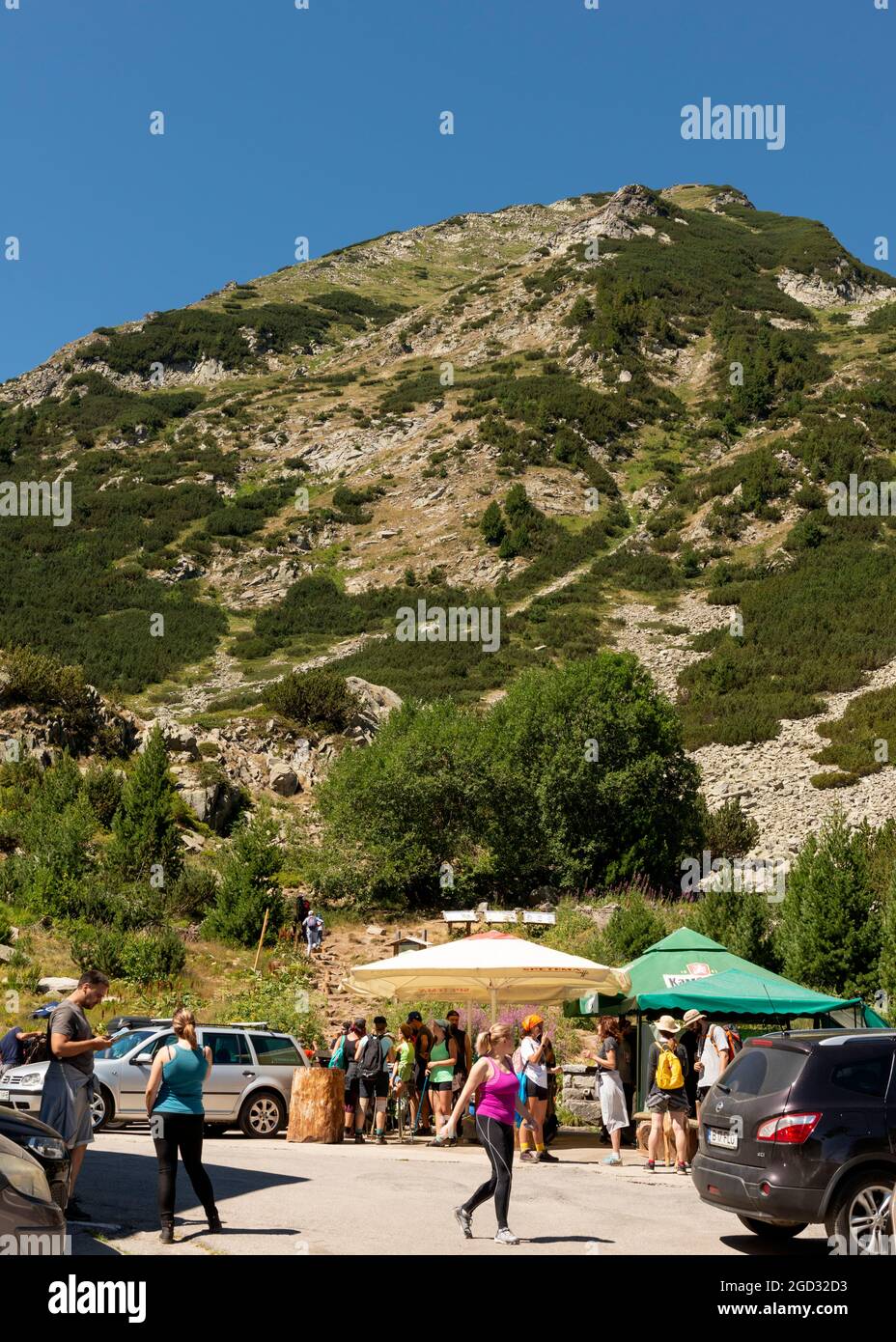 Hiking Bulgaria. Hikers at a refreshments for sale tent at the Vihren Hut in Pirin National Park and Reserve, Pirin Mountain, Bulgaria, Balkans Stock Photo