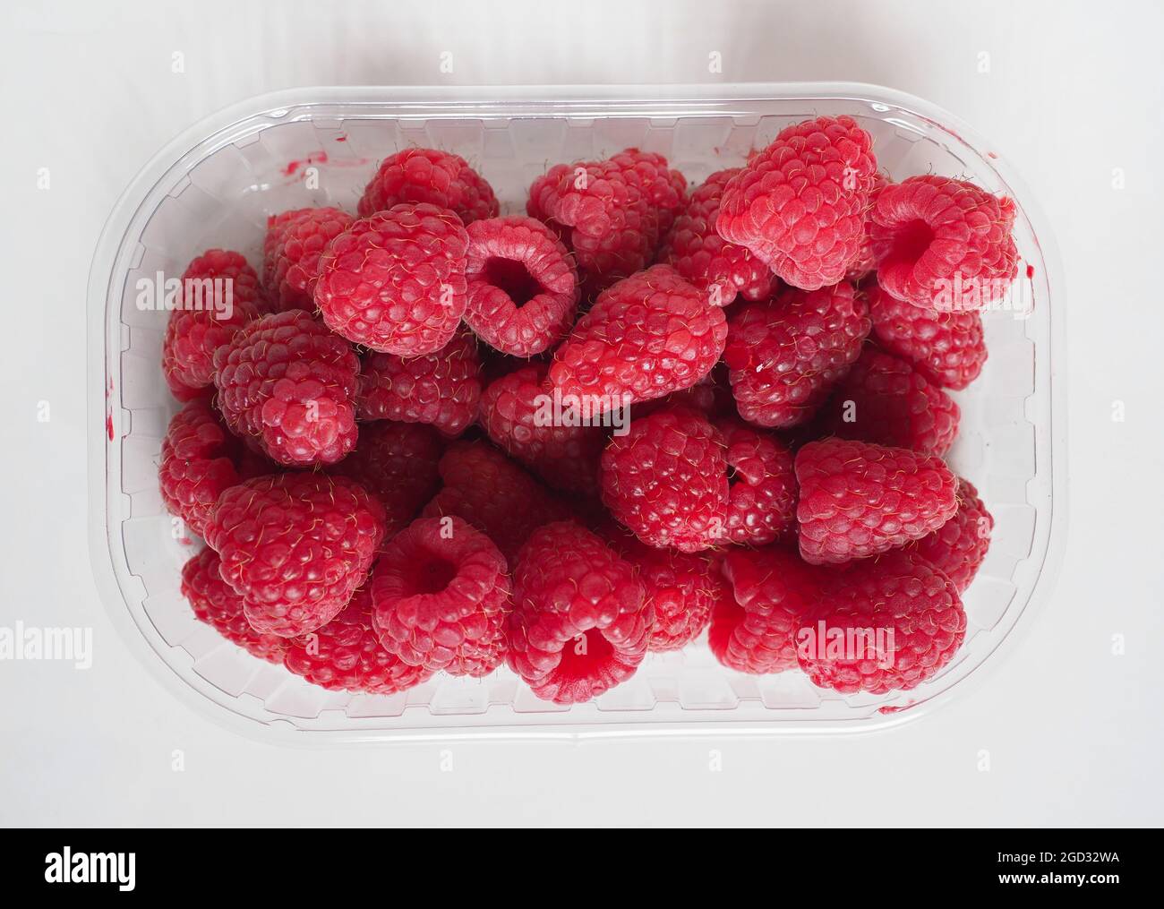 raspberry fruits in a takeaway plastic box Stock Photo - Alamy
