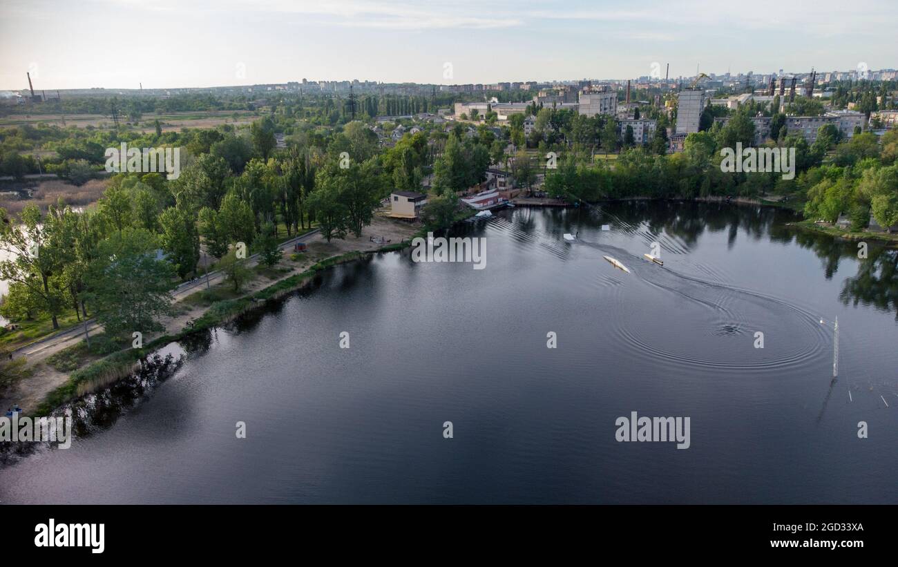 Aerial panoramic view on Wake Park recreation area on lake Komsomolske Ozero in Kharkiv, Ukraine. Wakeboarding water sports Stock Photo