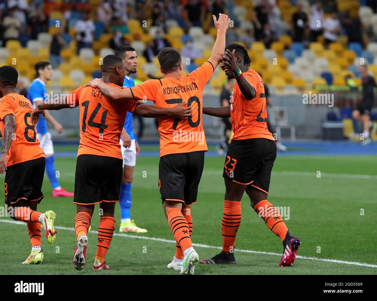 KYIV, UKRAINE - AUGUST 10, 2021 - Midfielders Tete, Yevhen Konoplyanka and forward Lassina Traore (L to R) of FC Shakhtar Donetsk are seen on the pitch during the 2021-22 UEFA Champions League third qualifying round second leg game against KRC Genk at the NSC Olimpiyskiy, Kyiv, capital of Ukraine. Stock Photo