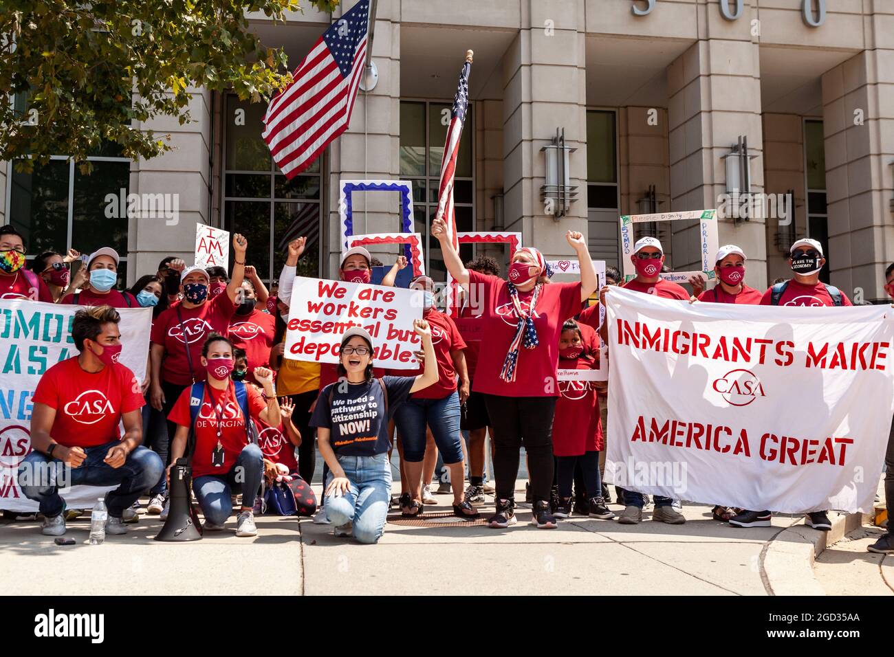 Washington, DC, USA, 10 August, 2021.  Pictured: Immigrants and supporters in front of the Immigration and Customs Enforcement (ICE) building during a rally demanding that ICE treat immigrants as people, not simply 'priority' or 'non-priority' categories.  Credit: Allison Bailey / Alamy Live News Stock Photo