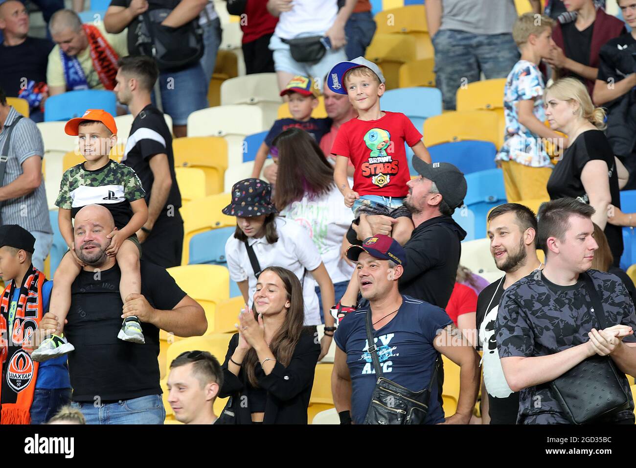 KYIV, UKRAINE - AUGUST 10, 2021 - Fans are seen on the stands during the 2021-22 UEFA Champions League third qualifying round second leg game between FC Shakhtar Donetsk and KRC Genk at the NSC Olimpiyskiy, Kyiv, capital of Ukraine. Stock Photo