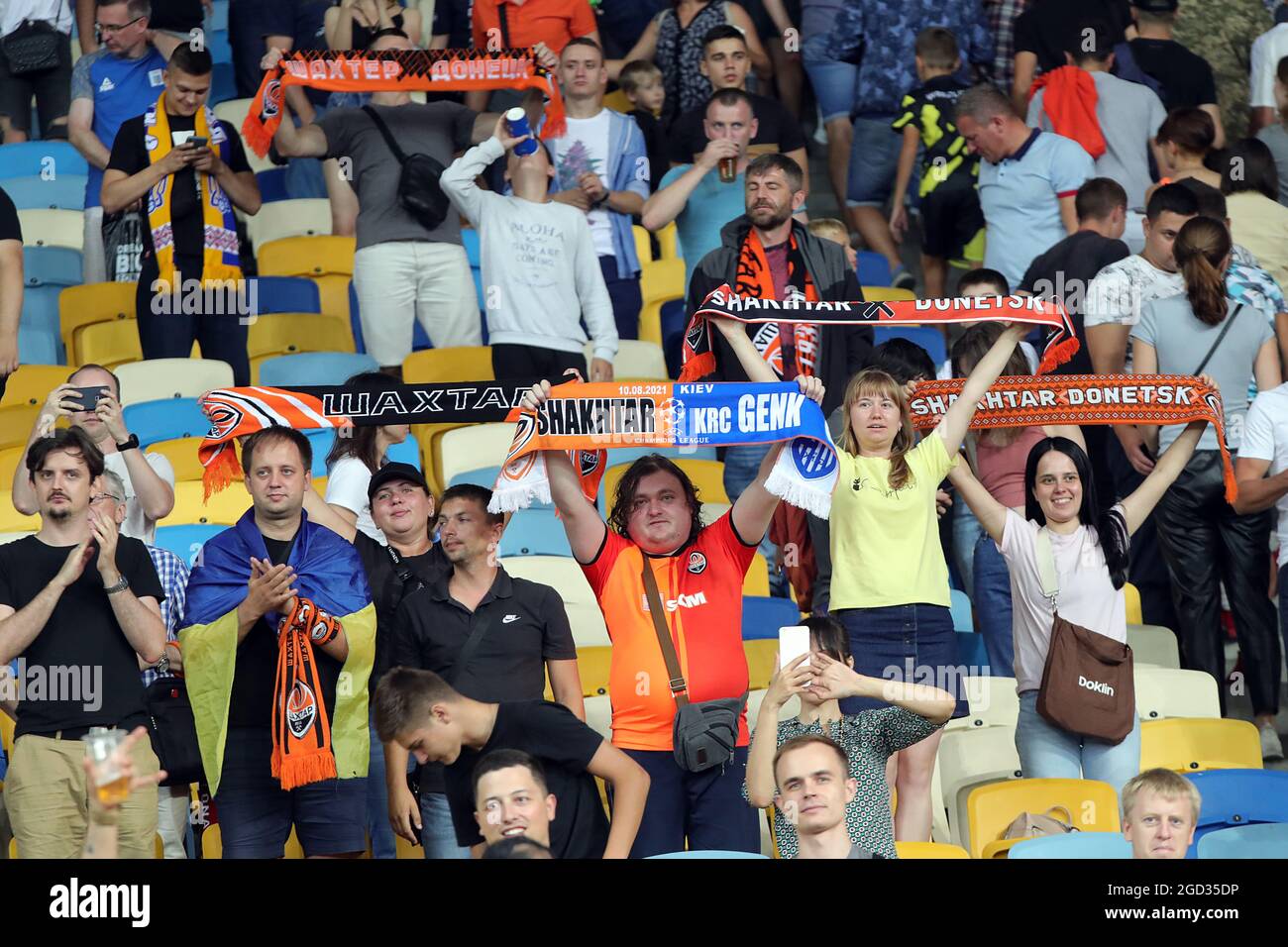 KYIV, UKRAINE - AUGUST 10, 2021 - Fans of FC Shakhtar Donetsk cheer on the team during the 2021-22 UEFA Champions League third qualifying round second leg game against KRC Genk at the NSC Olimpiyskiy, Kyiv, capital of Ukraine. Stock Photo