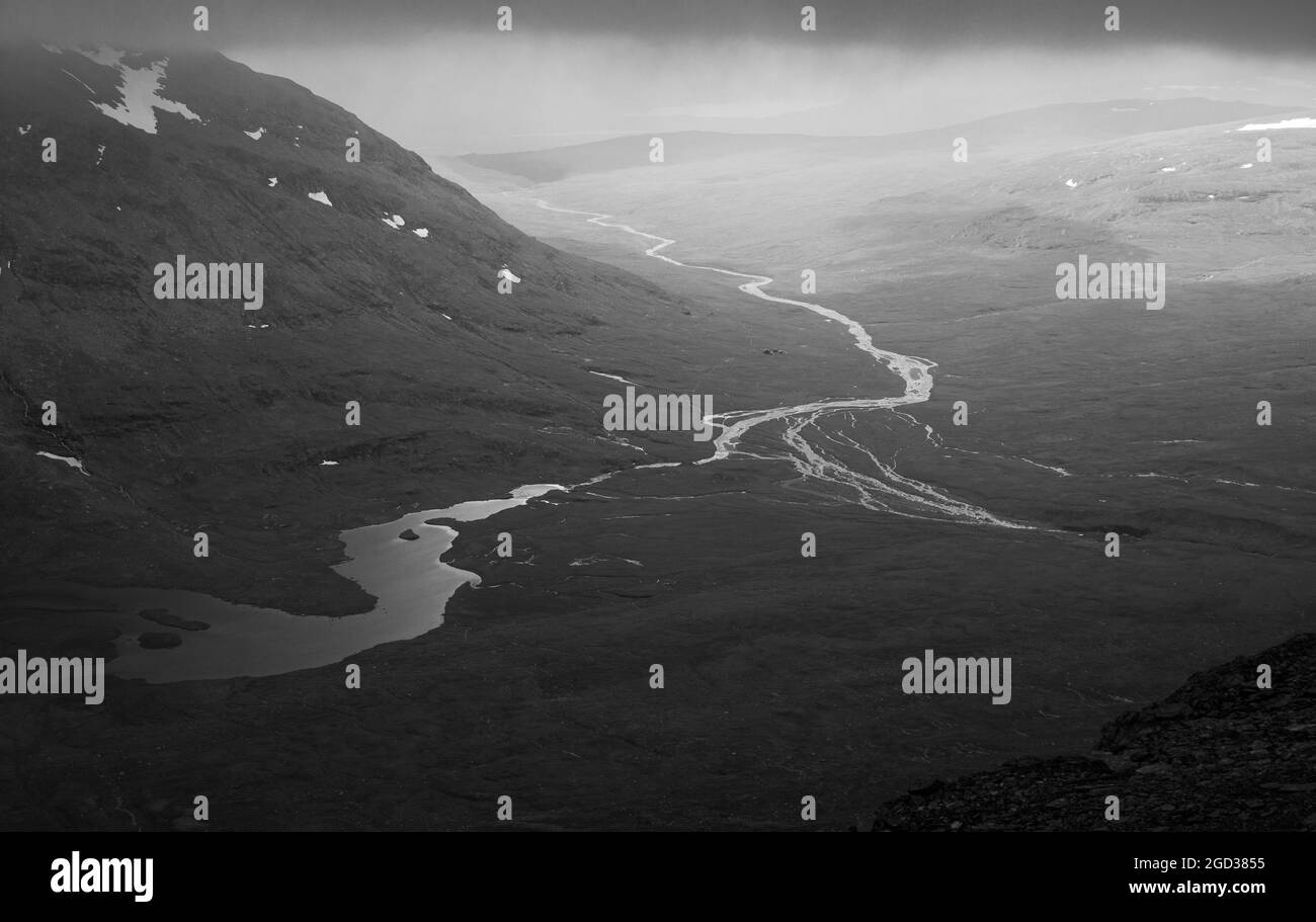 The view from a hiking trail to Sytertoppen mountain, Kungsleden trail, Swedish, Lapland, black and white. Stock Photo