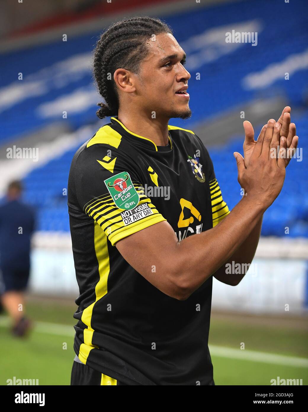 Coby Rowe #4 of Sutton United applauds the supporters following end of the game Stock Photo