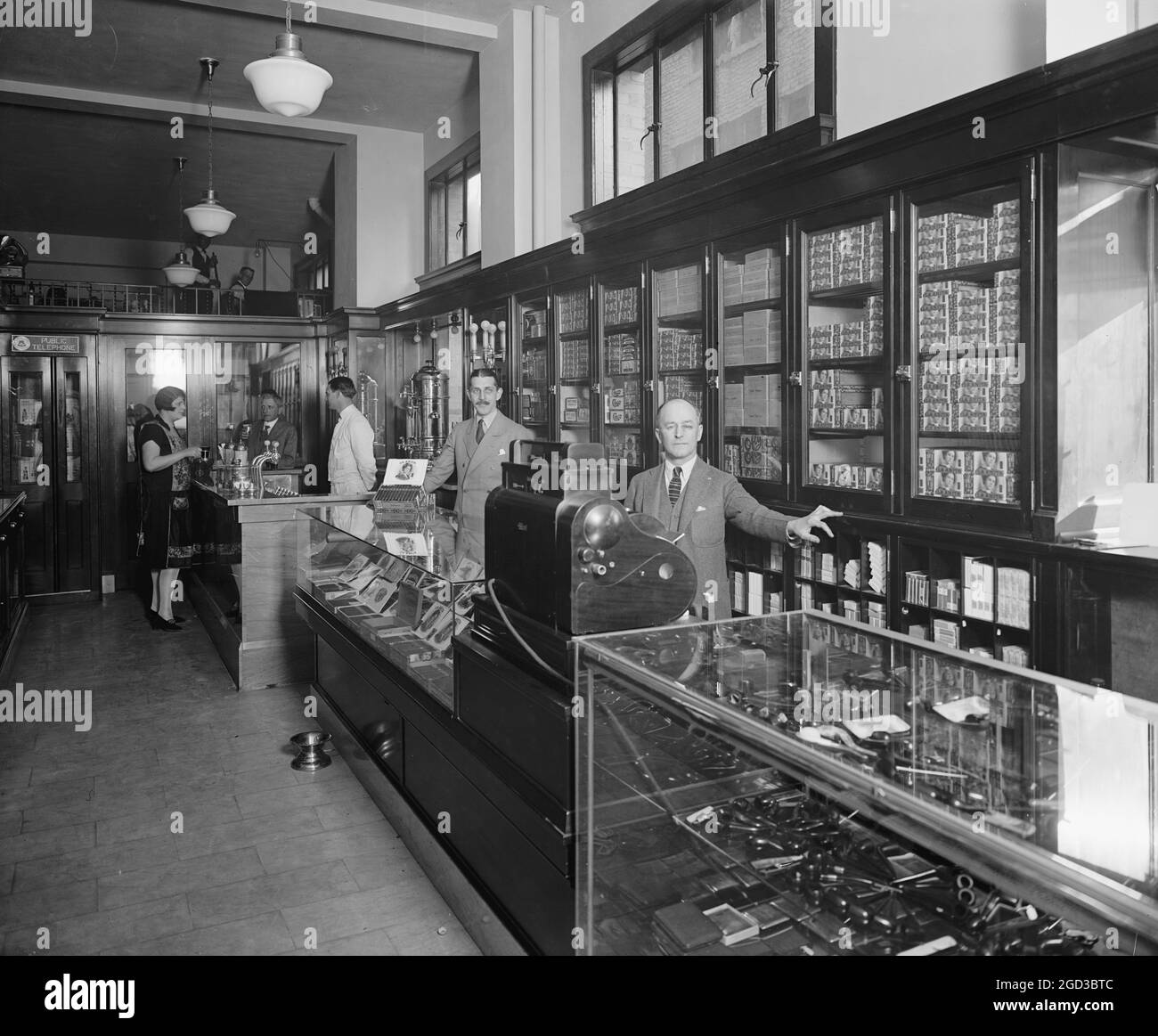 Employees behind display cases at the Offterdinger Cigar Store in Washington DC ca. between 1910
