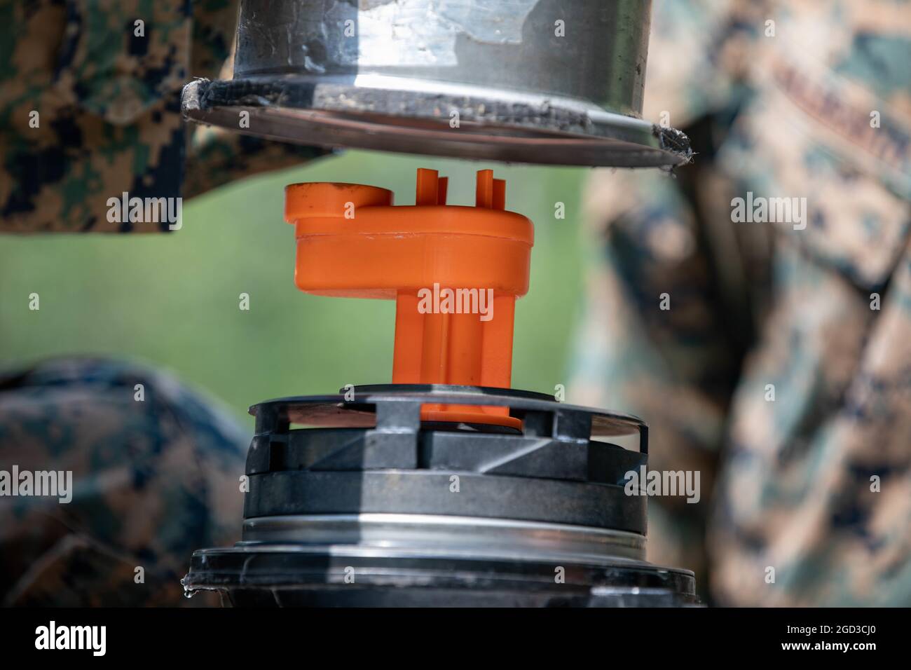 Marines with Combat Logistics Battalion 451, 4th Marine Logistics Group, replace a component of a water pump with one 3D-printed in the field during Northern Strike 21-2 at Camp Grayling, Michigan on Aug 7, 2021. Marines with Marine Force Reserve support Northern Strike 21-2, an exercise that can sustain and build readiness. (U.S. Marine Corps photo by Lance Cpl. Colby Bundy) Stock Photo