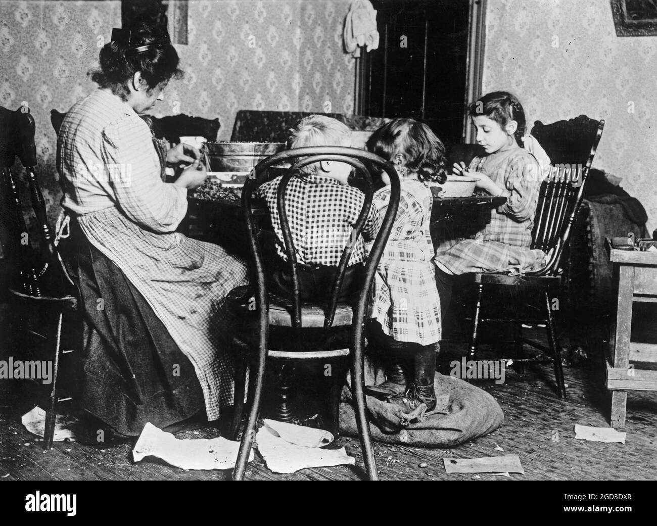 Children Ages 4 6 And 9 Picking Nuts In A Basement Tenement Filth