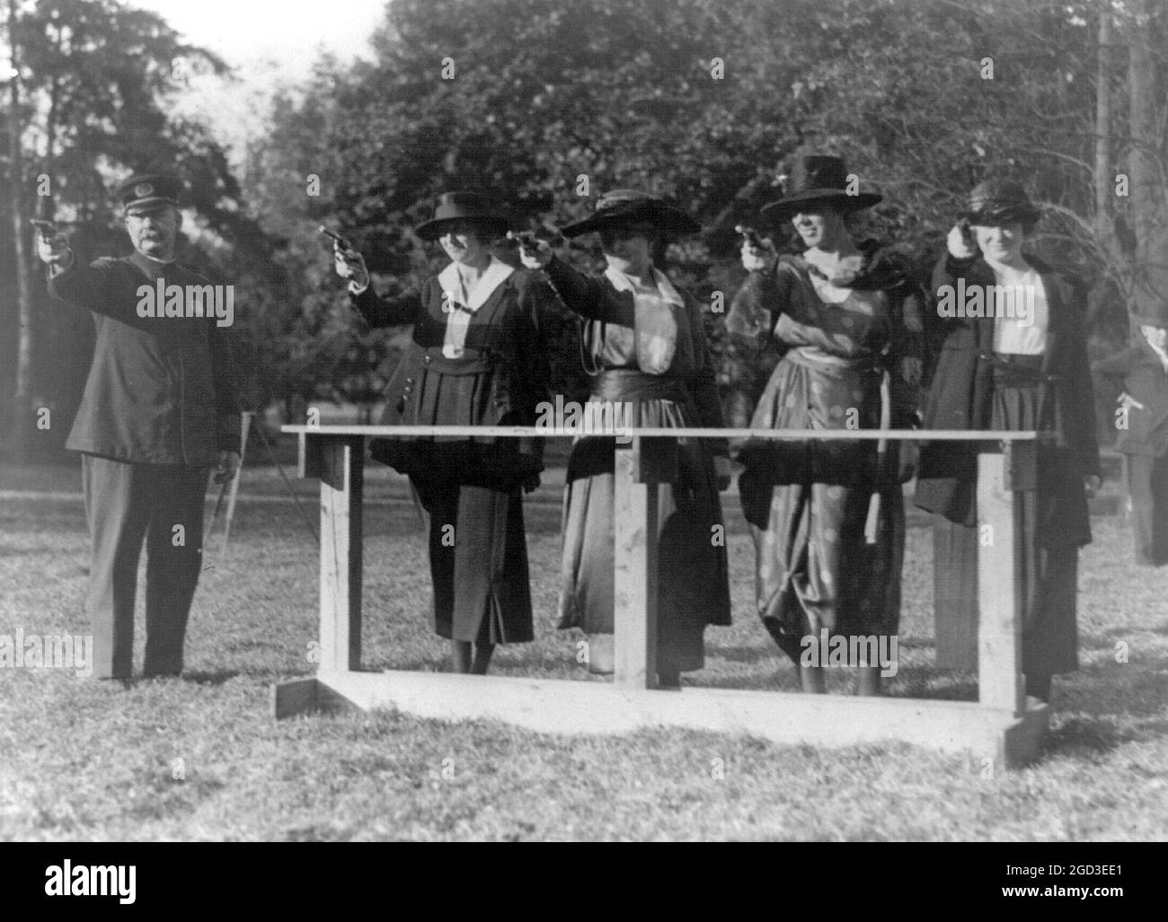 Training a policewoman--target practice under the direction of ...