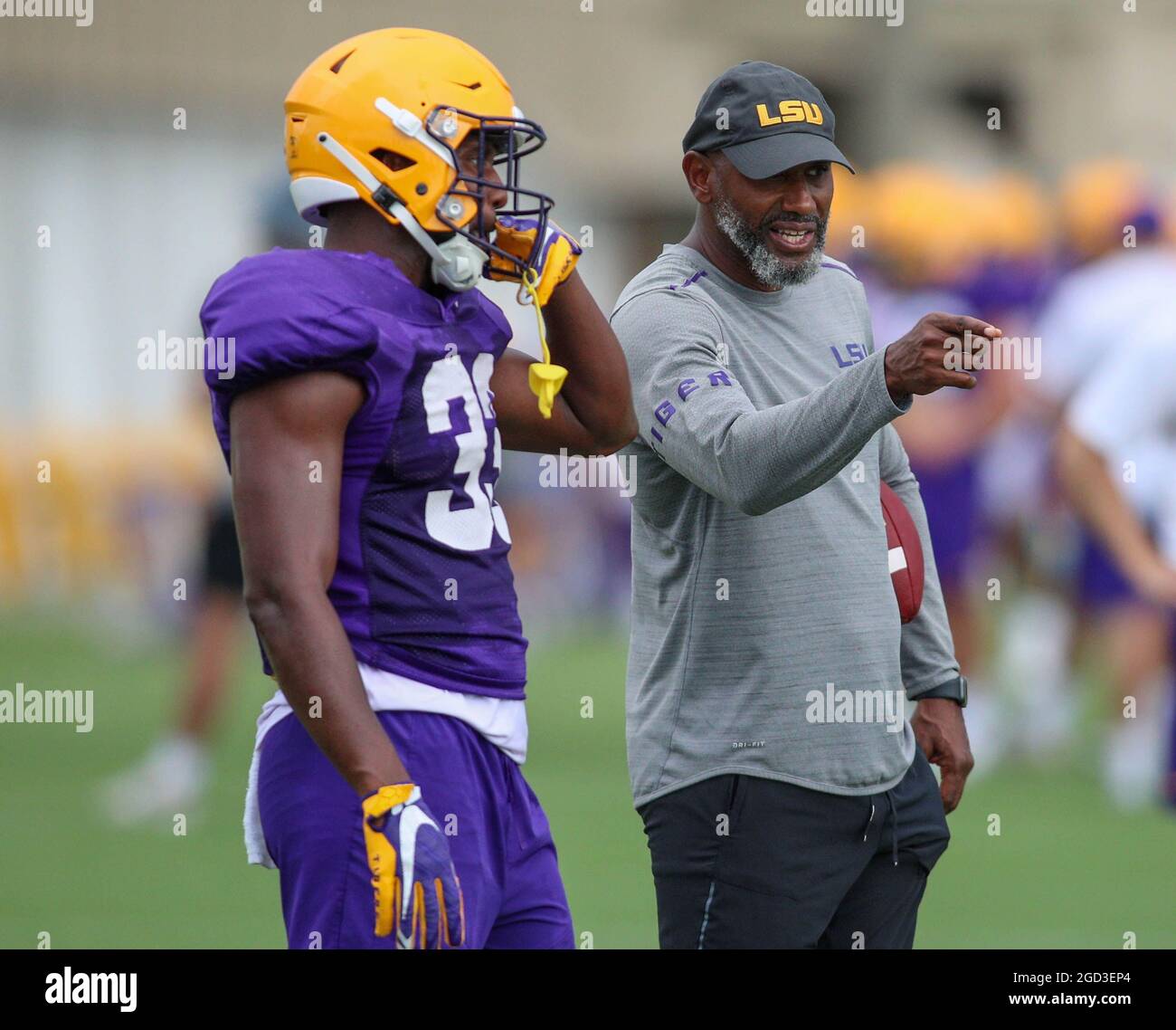 August 10, 2021: LSU Defensive Back Coach Corey Raymond talks with Lloyd Cole (33) during the first week of fall football camp at the LSU Charles McClendon Practice Facility in Baton Rouge, LA. Jonathan Mailhes/CSM Stock Photo
