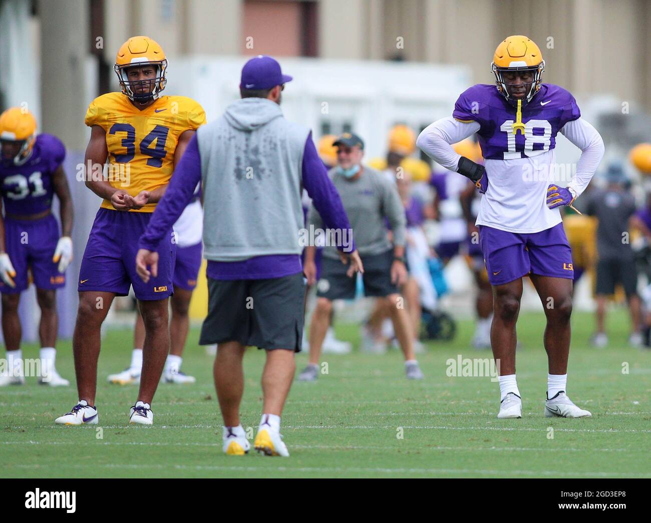August 10, 2021: LSU Linebacker Coach Blake Baker goes over a drill with linebackers Antoine Sampah (34) and Damone Clark (18) during the first week of fall football camp at the LSU Charles McClendon Practice Facility in Baton Rouge, LA. Jonathan Mailhes/CSM Stock Photo